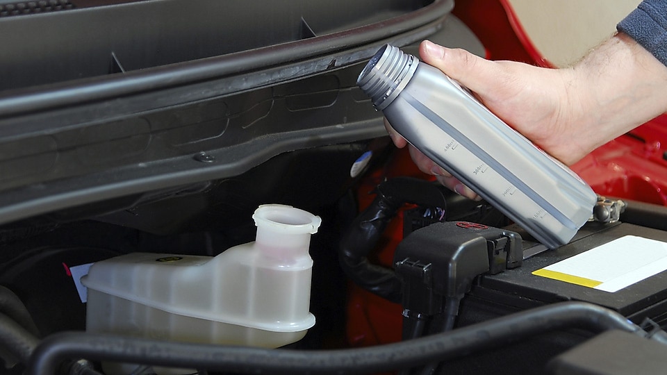 Carefully add Quaker State automatic transmission fluid in small increments